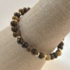 Bague perle œil de tigre et acier